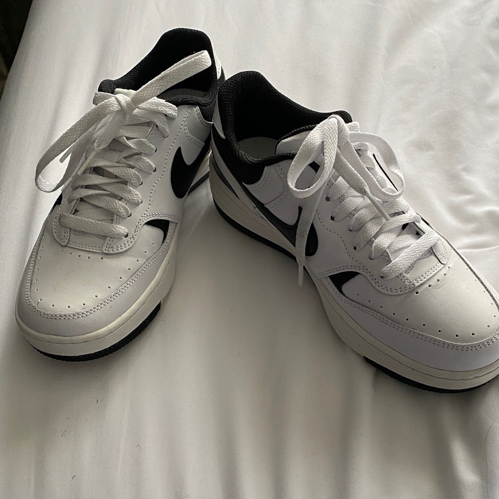 Women’s Nike White and Black Leather Sneakers